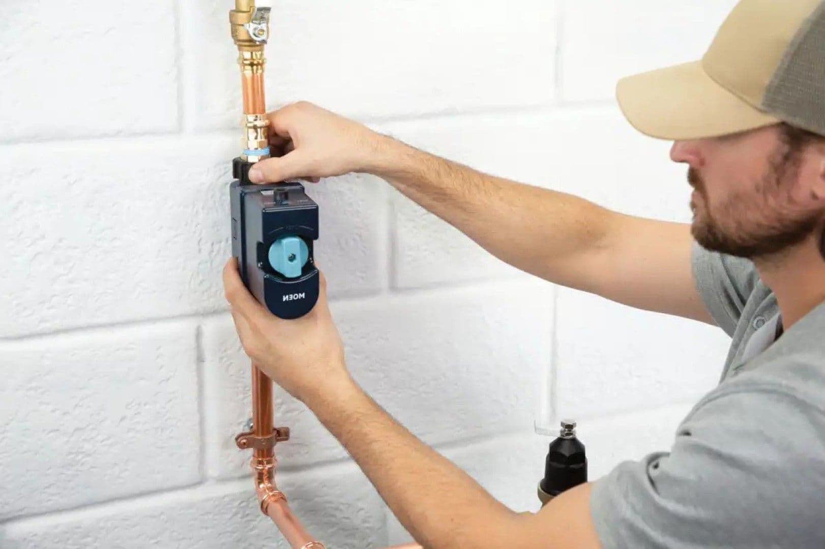 Plumber-installing-Flo-Smart-Water-Monitor-Shutoff